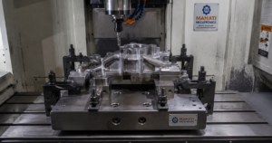 Custom machined jig and fixture set on a workbench showing jigs and fixtures manufacturer capability at Mahati Bangalore