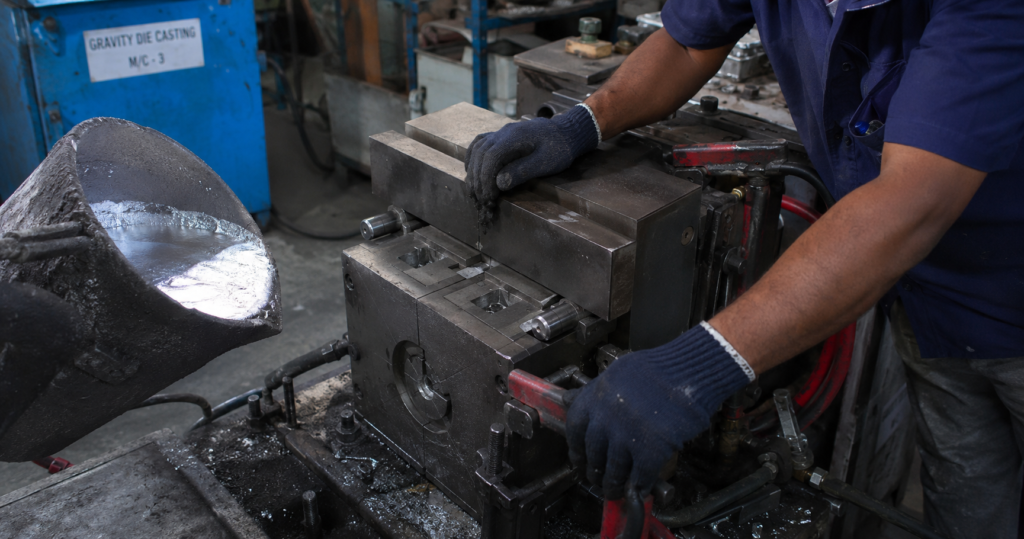 Aluminium gravity die casting mould being closed showing gravity die casting process at Mahati Bangalore