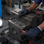 Aluminium gravity die casting mould being closed showing gravity die casting process at Mahati Bangalore