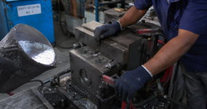 Aluminium gravity die casting mould being closed showing gravity die casting process at Mahati Bangalore
